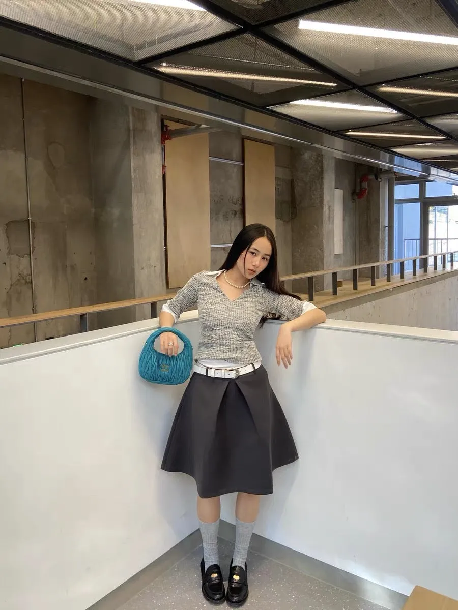 Pleated puffy black A-line skirt