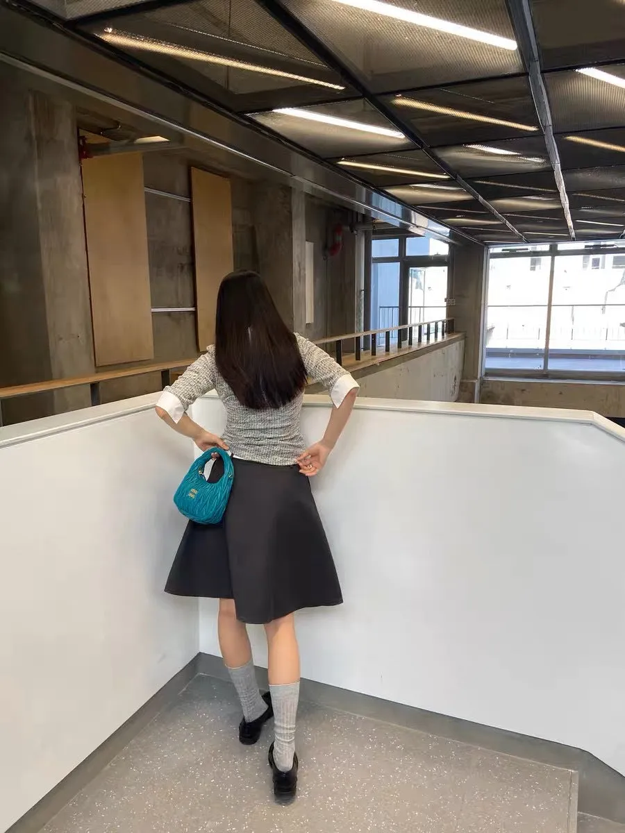 Pleated puffy black A-line skirt