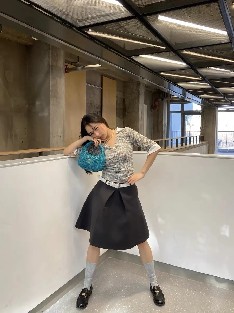 Pleated puffy black A-line skirt